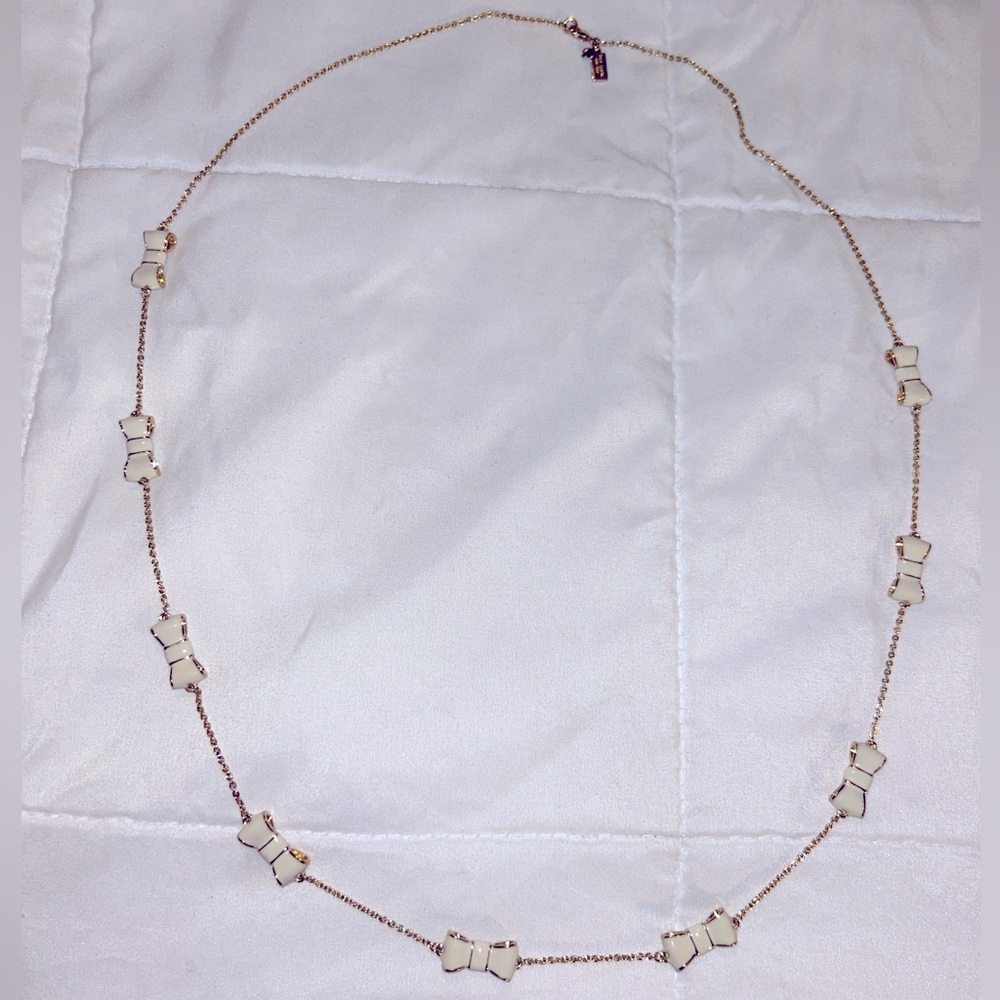 Kate Spade Take A Bow necklace (white/gold)